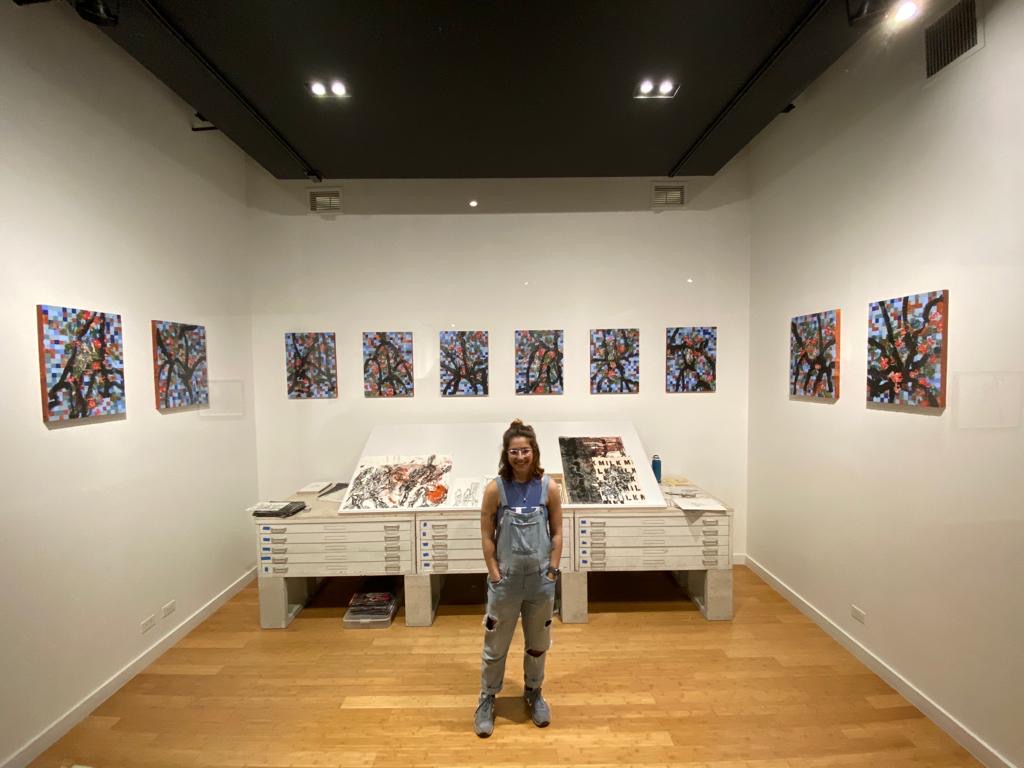 Honors College student and Project Room curator Sofia Guerra setting up in preparation for "The Roses of Fibonacci," a solo exhibition by John William Bailly.