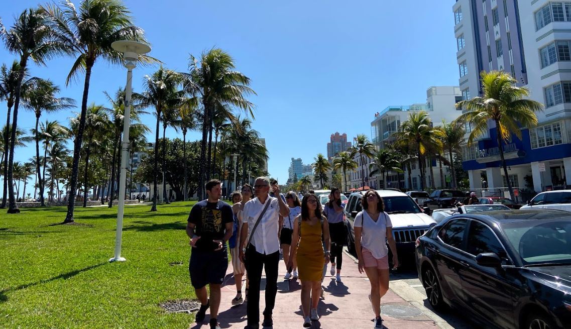 Prof JW Bailly and MIM students on walking lecture down Ocean Drive