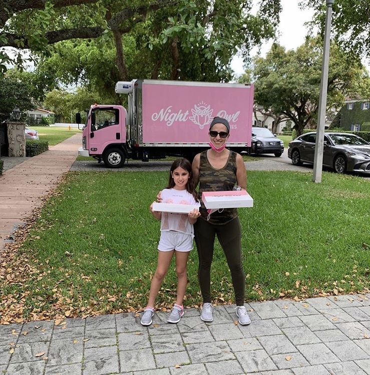 Alexia and mom, Cindi, eating cookies for a good cause