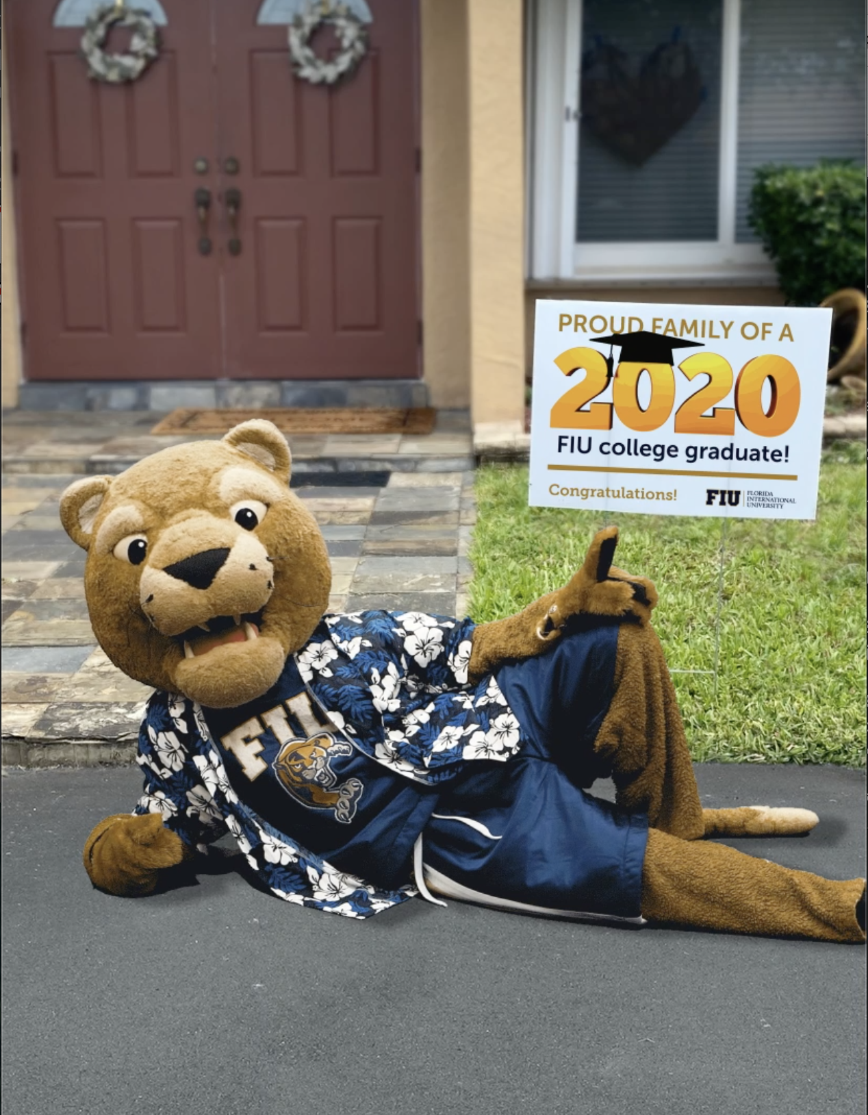 Roary with an FIU Grad Yard Sign