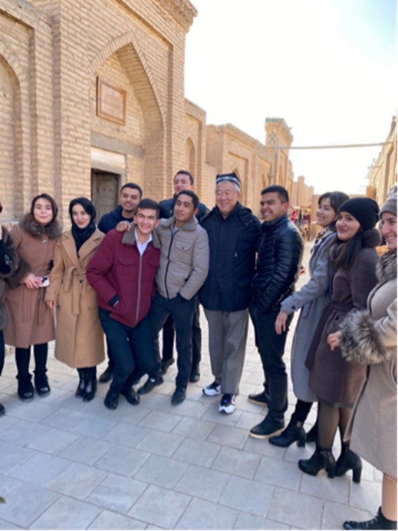 Jinlin Zhao (center) with University of Urgech students in the Silk Road city of Khiva