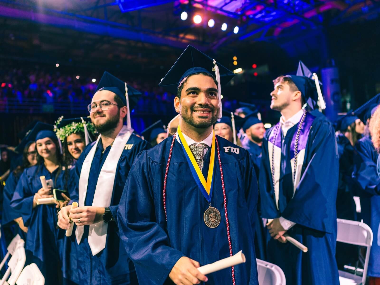 Graduate with medal smiling