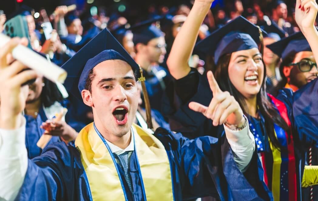 Group of graduates cheering