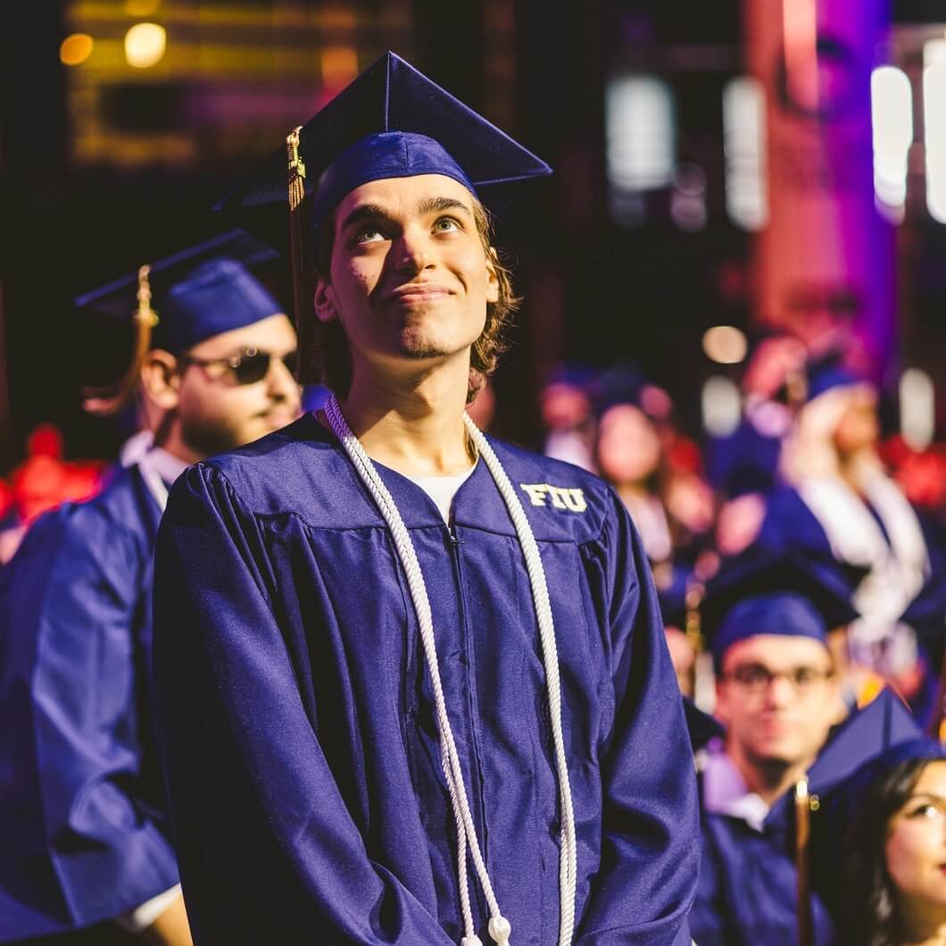 Graduate smiling in spotlight