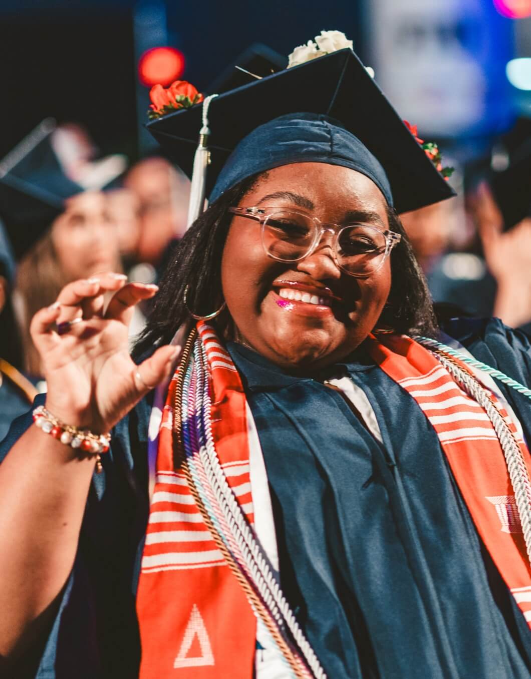 Graduate doing Paws Up gesture