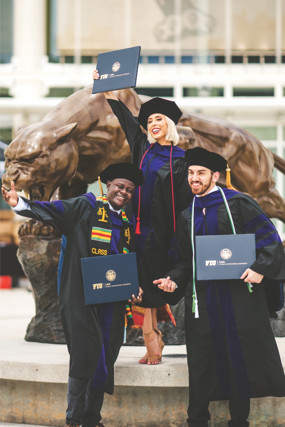 FIU Law graduates at commencement at the panther statue