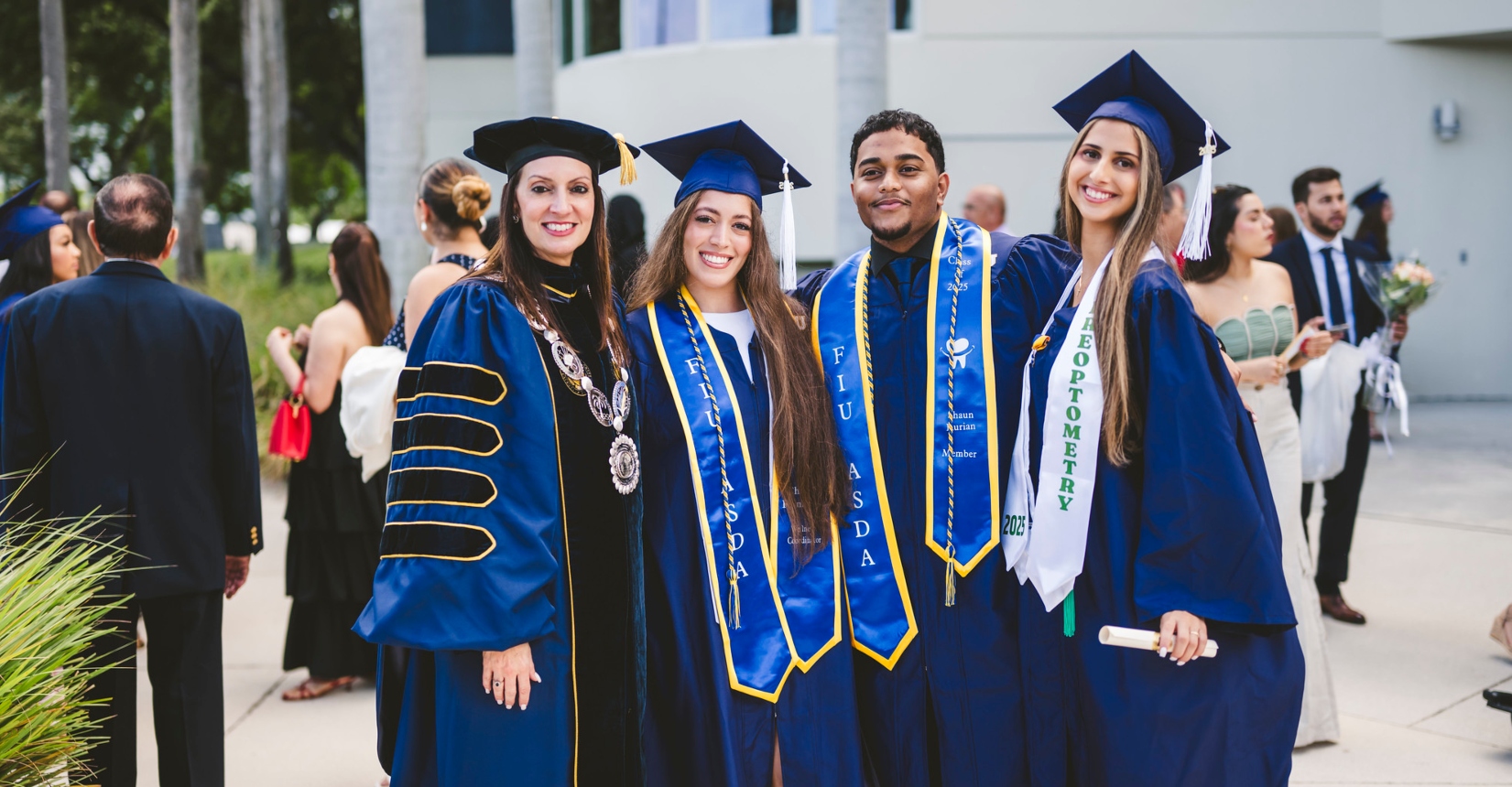 Group of graduates with FIU President Jeanette M. Nuñez