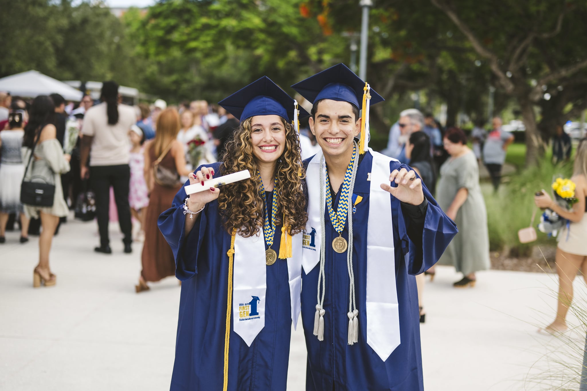 Graduate posing with family member
