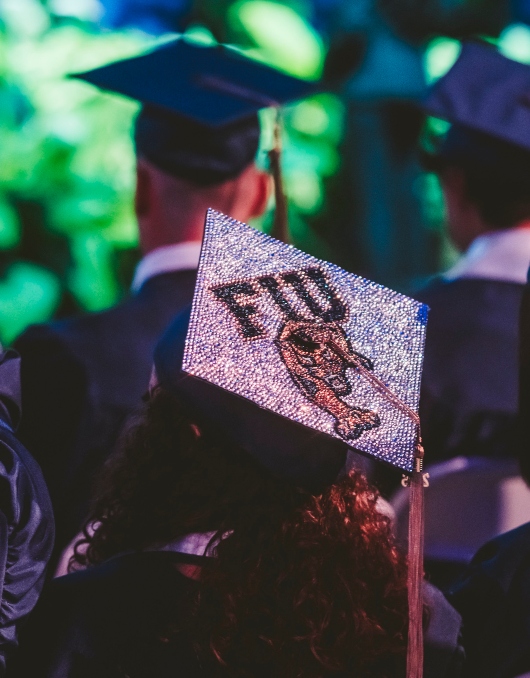 Graduate's cap decorated with FIU and Panther