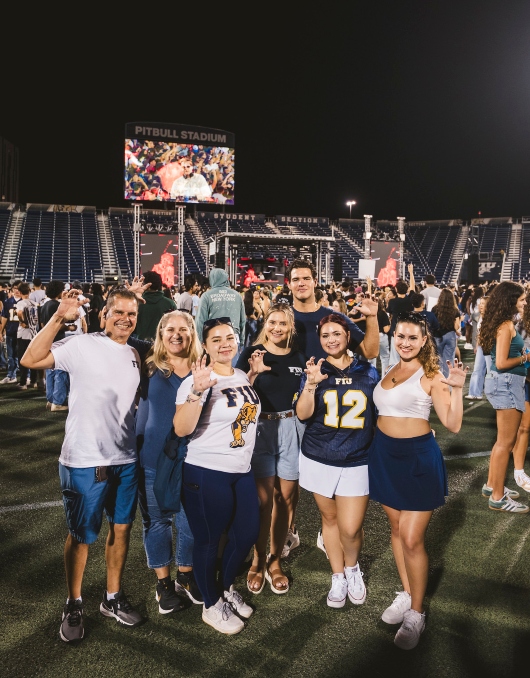 Students and family on the field