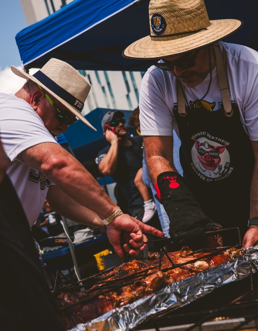 Herbert Wertheim College of Medicine team roasting their pig