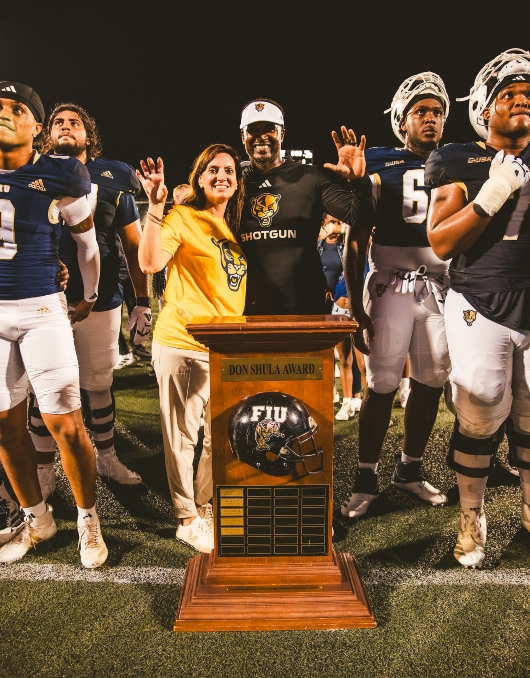President Jeanette M. Nuñez and Head Football Coach Willie Simmons