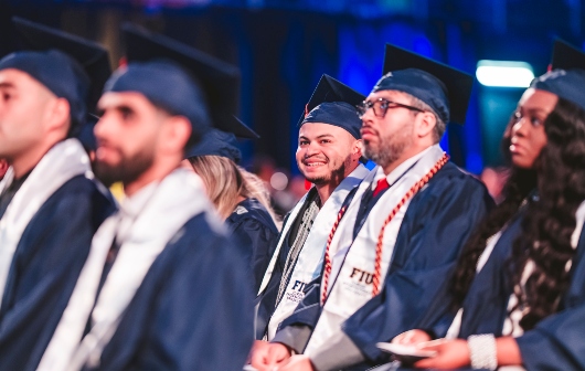 Graduates smiling during the commencement ceremony