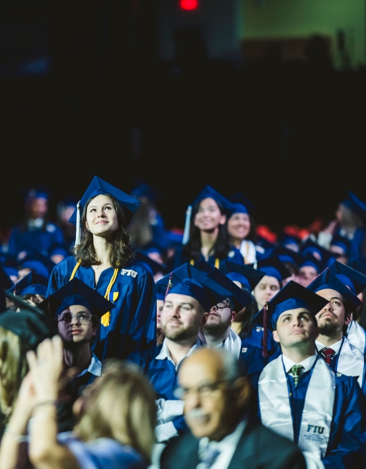 Students standing to be recognized during the ceremony