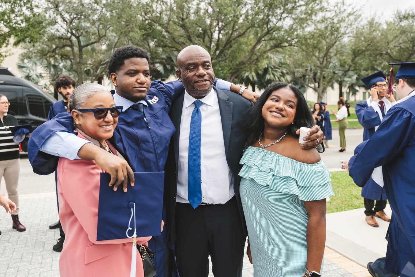 Graduate celebrating with his family