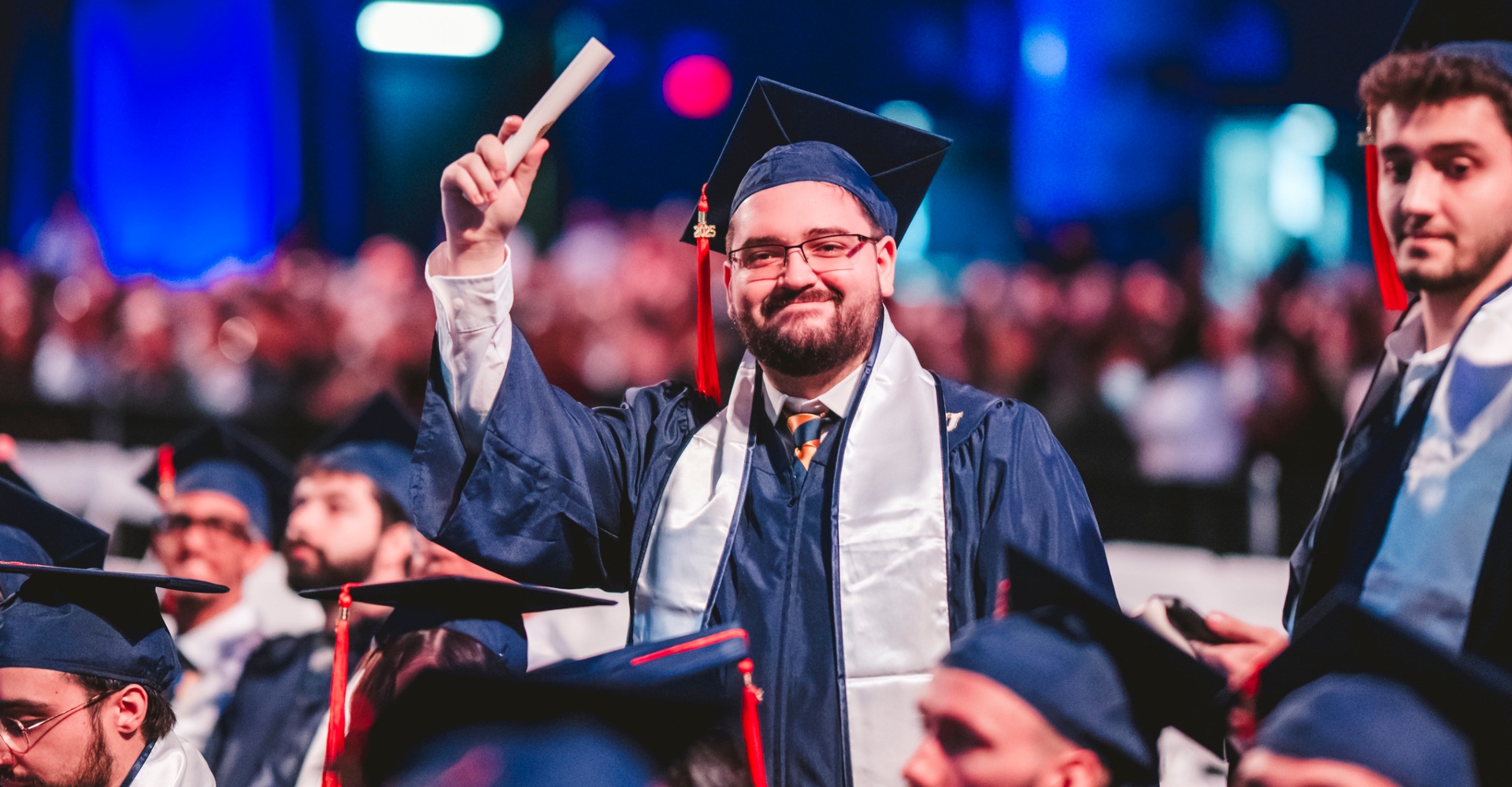 Student holding up diploma