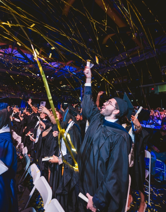 Graduate celebrating