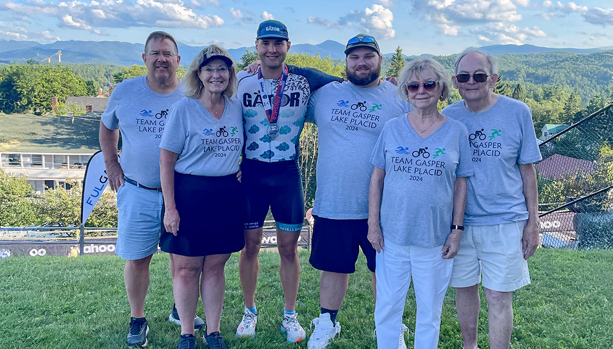 Gasper celebrates with his family after finishing IRONMAN Lake Placid.