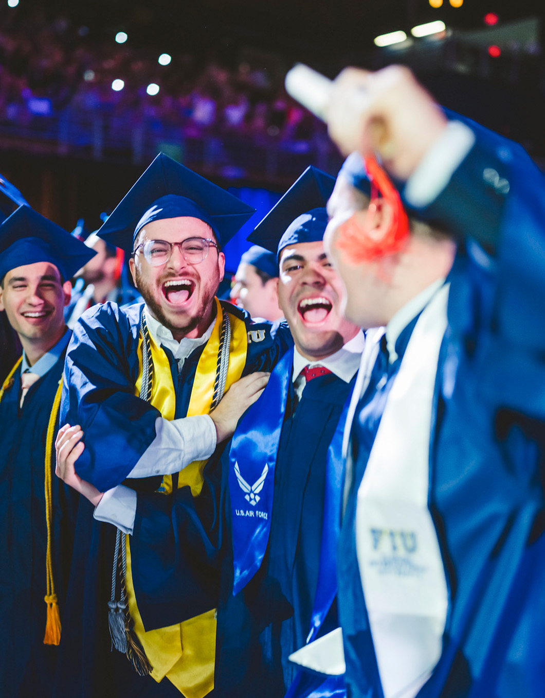 A group of graduates cheering