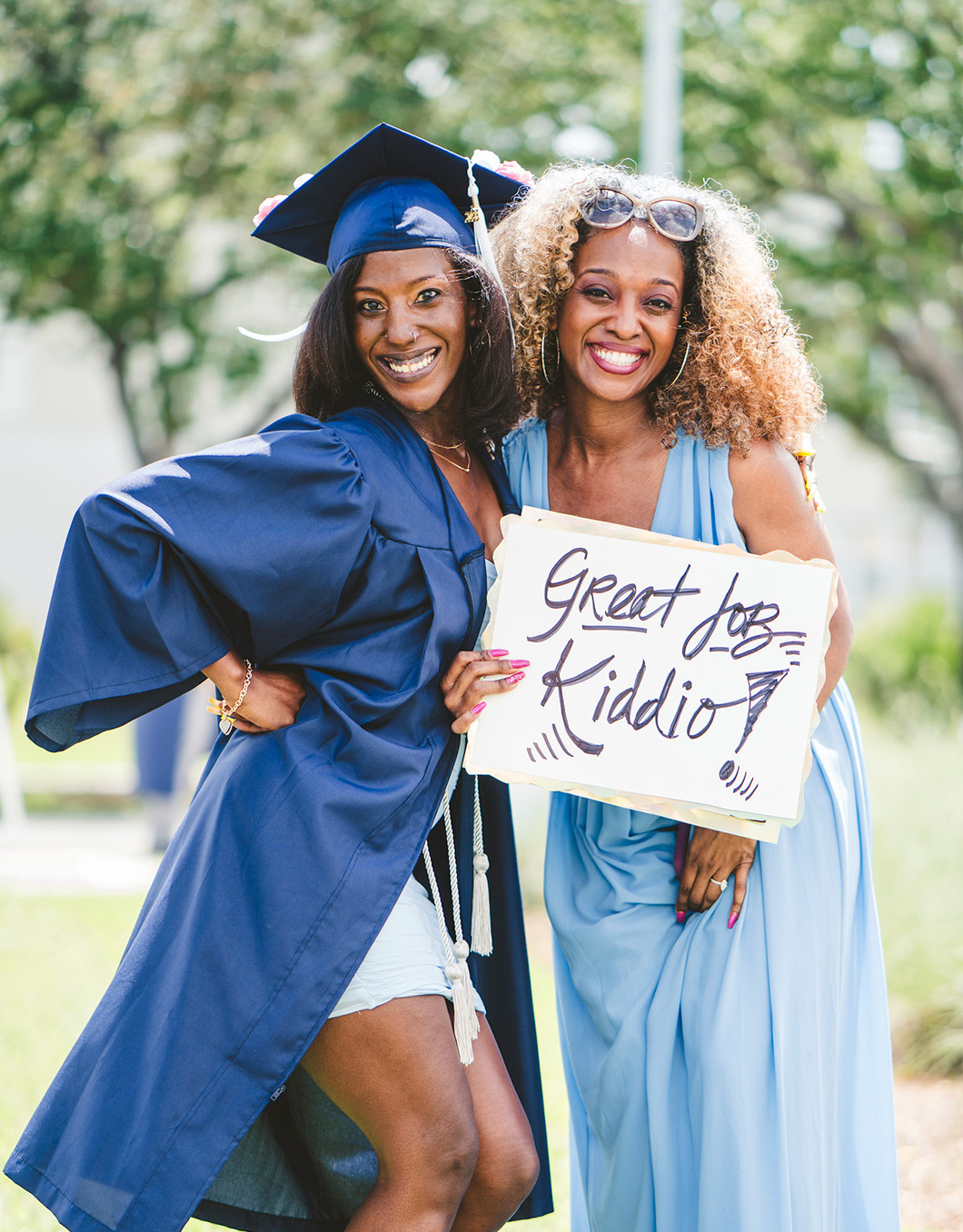 Graduate celebrating with her family member