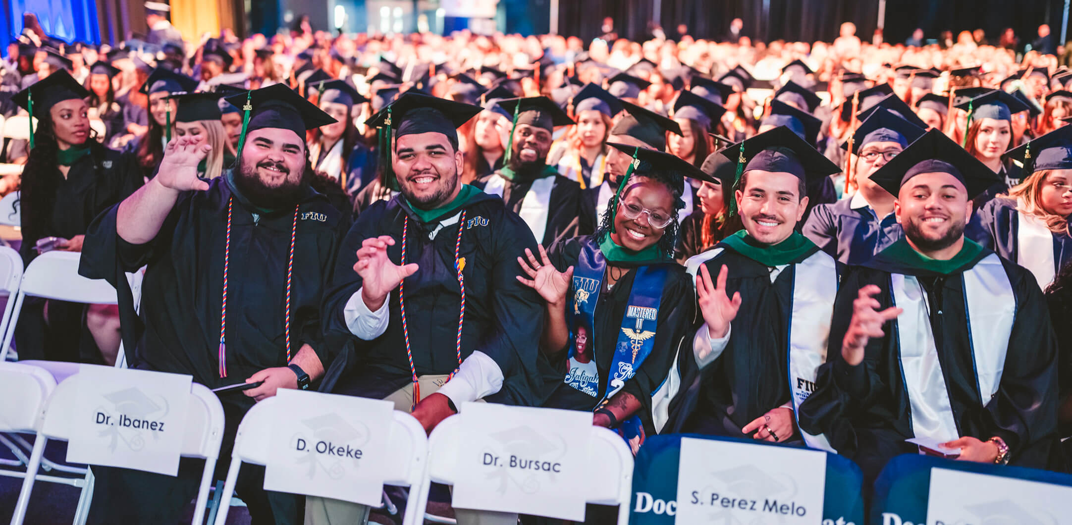 Graduates with their paws up