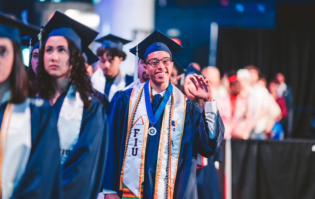Graduate with their paws up