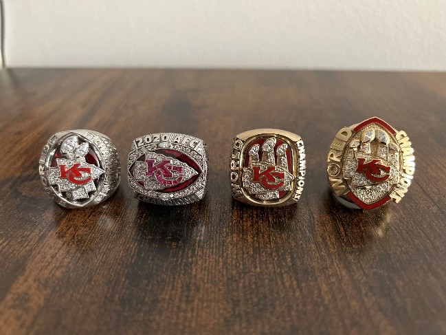 Photo of Danny's three super bowl rings and one AFC championship ring