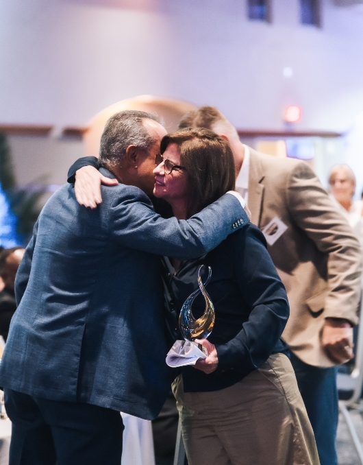 Cindy Russo being congratulated 