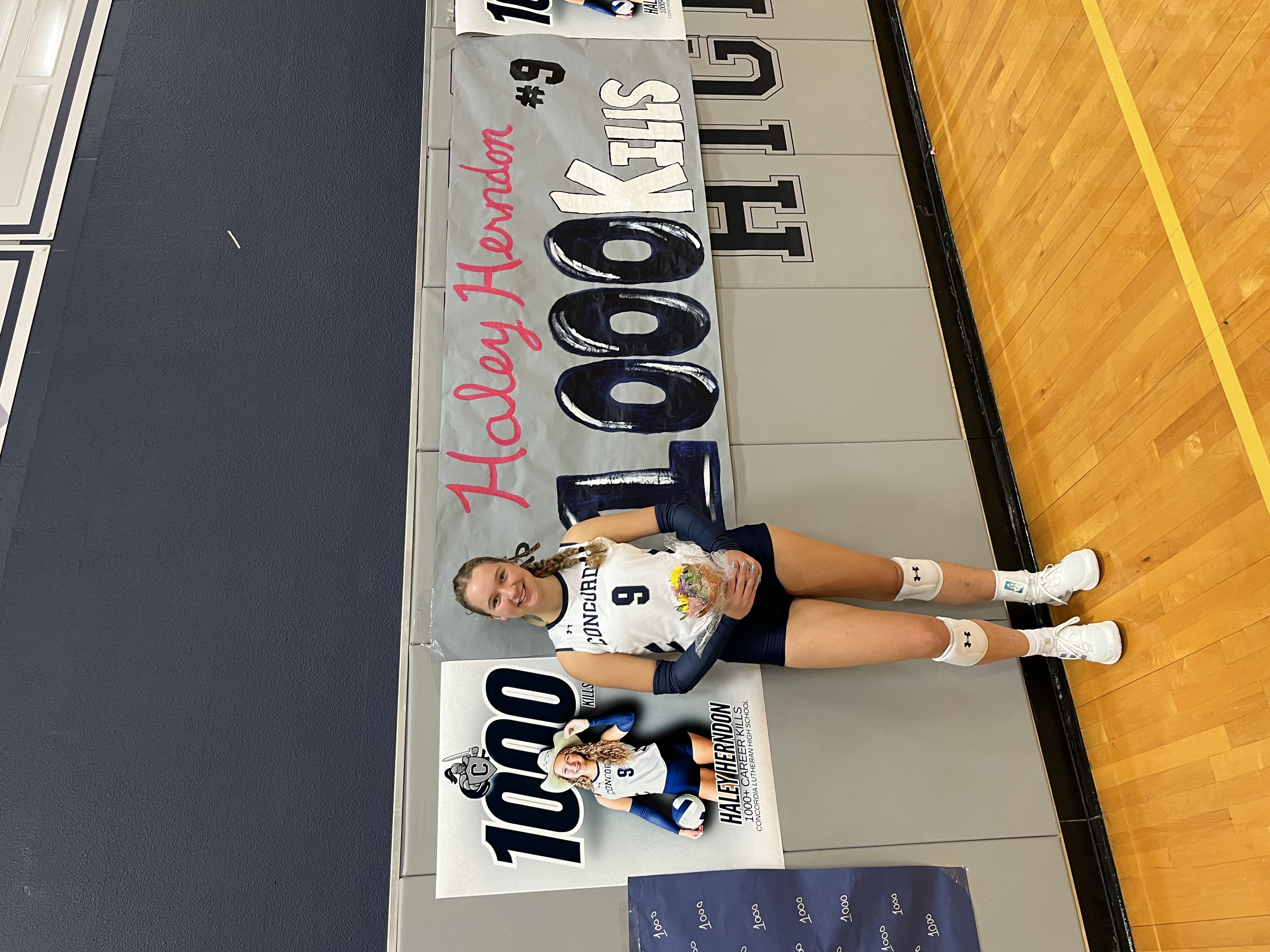Haley Herndon in high school volleyball uniform