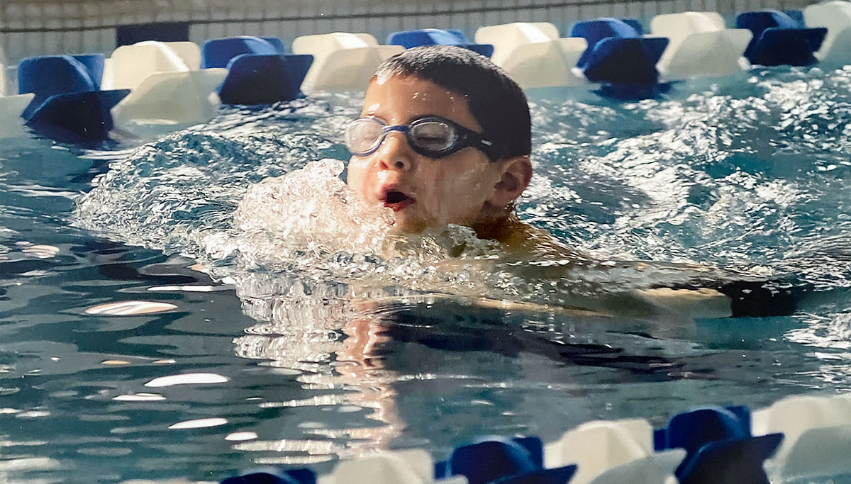 Med student Alexander Gasper at six years old in his swimming portion of first triathlon.