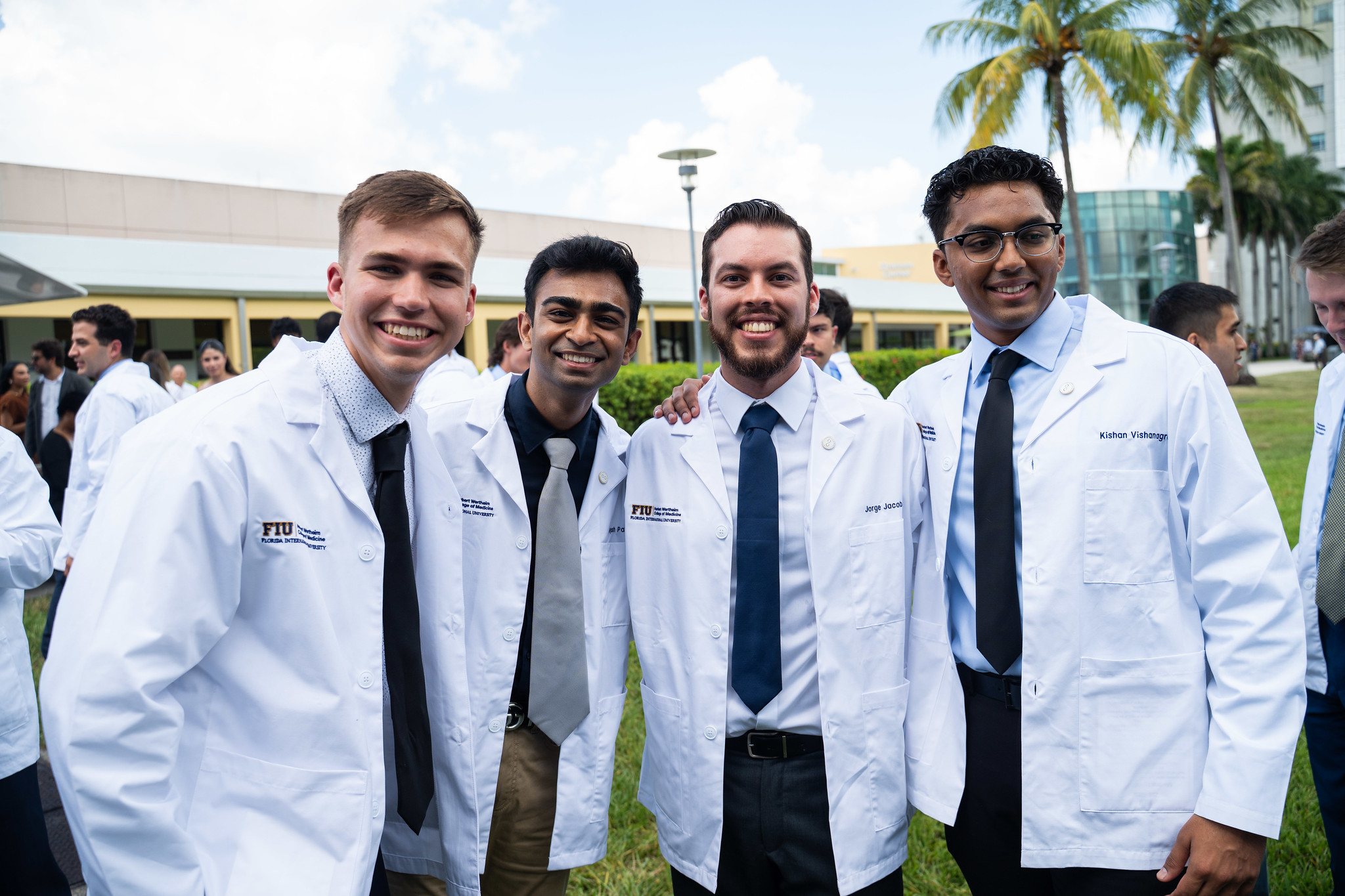 Incoming medical students Christopher May, Ayush Patel, Jorge Jacob, and Kishan Vishanagra proudly show off the newest addition to their wardrobe—their white coats.