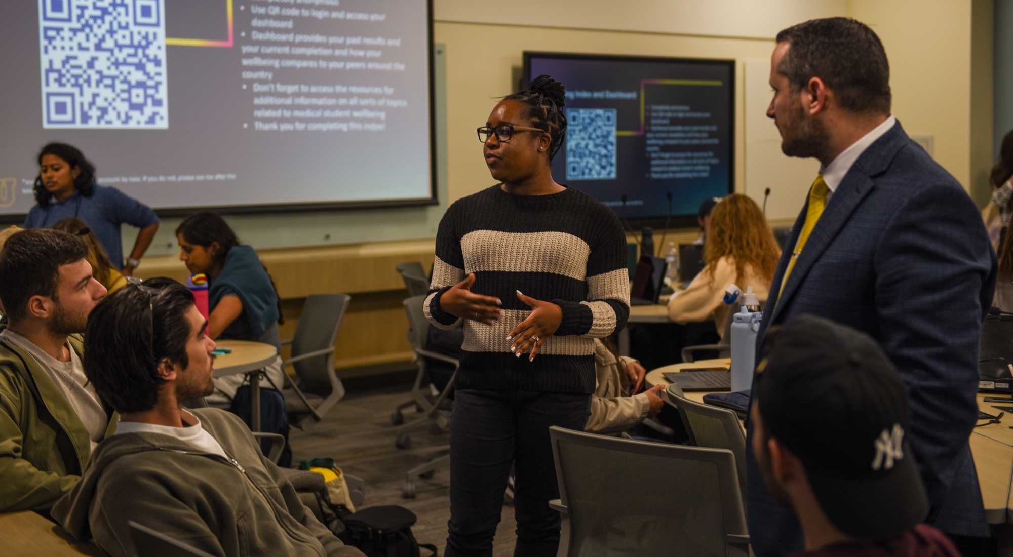 Career advisors speaking with medical students at a town hall