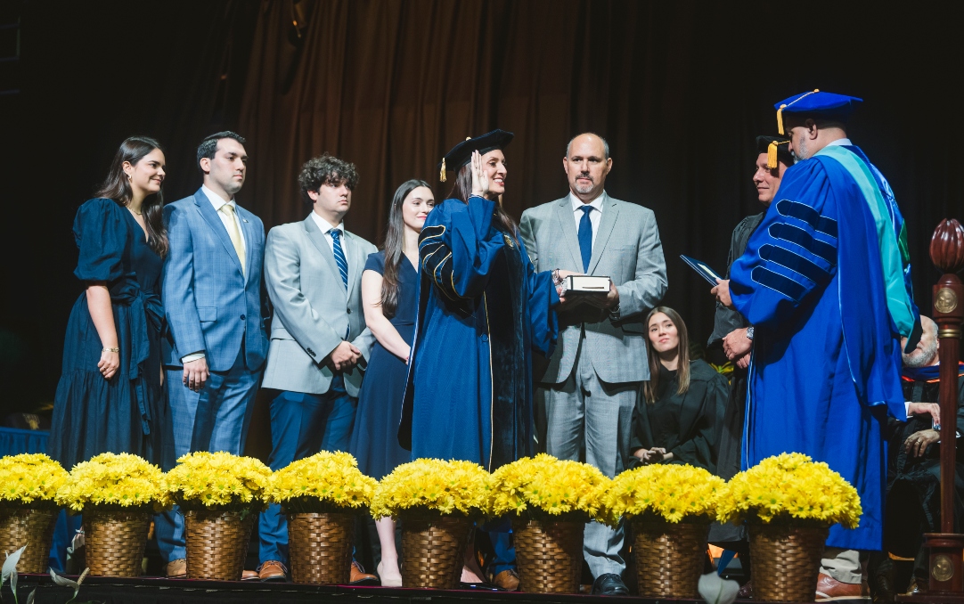 Jeanette M. Nuñez, accompanied by her family, is sworn in as FIU's seventh president by Ray Rodrigues, chancellor of the State University System of Florida.  From left to right, Isabel Nuñez, Justin Nuñez, Jason Nuñez, Megan Rocher, FIU President Jeanette M. Nuñez, Adrian Nuñez, FIU SGA President Francesca Casanova (sitting), FIU Board of Trustees Chair Carlos A. Duart, and State University System Chancellor Ray Rodrigues. Also on stage but not shown: Gabriel Rocher.