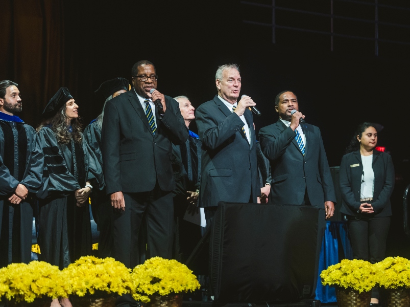 Steven Ellis, Louis Melbourne, and Donald Roomes from the College of Business sing a stirring rendition of the FIU Alma Mater
