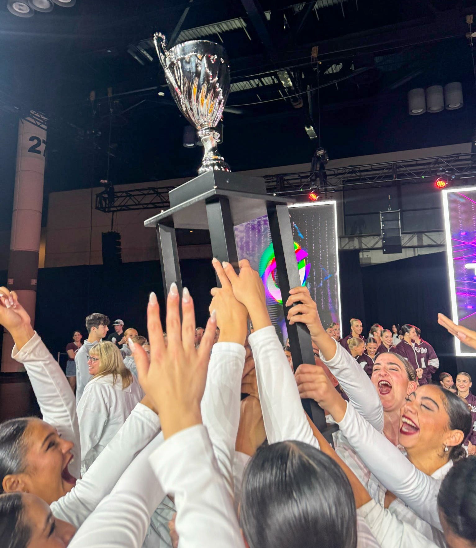 The dance club team with the trophy