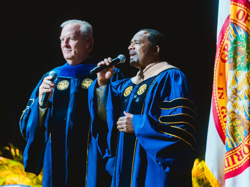 Administrators singing at commencement