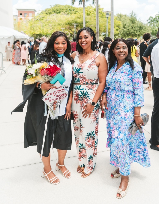 Graduate celebrating with her family
