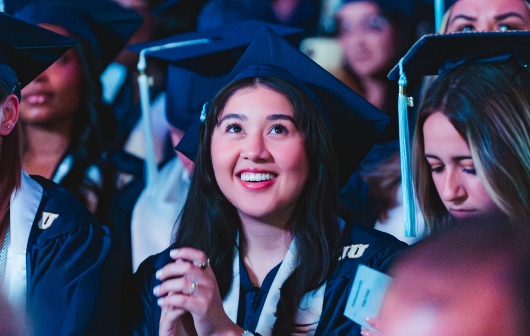Graduate cheering during commencement