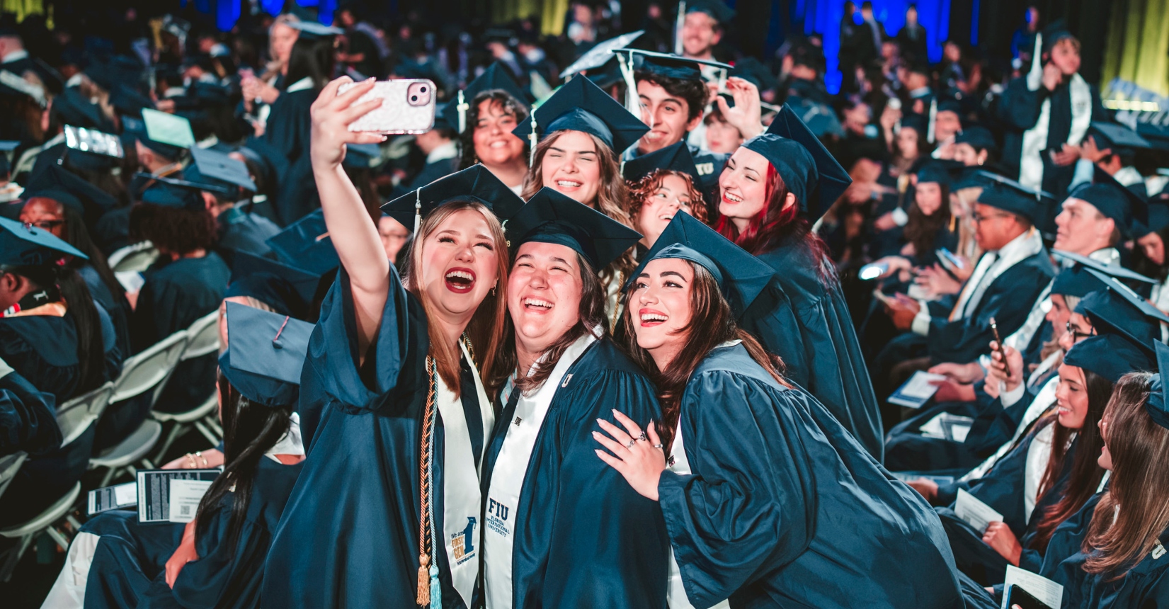Students taking a selfie and celebrating