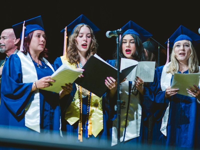 Students singing at commencement
