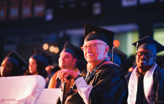 Student smiling during the commencement ceremony