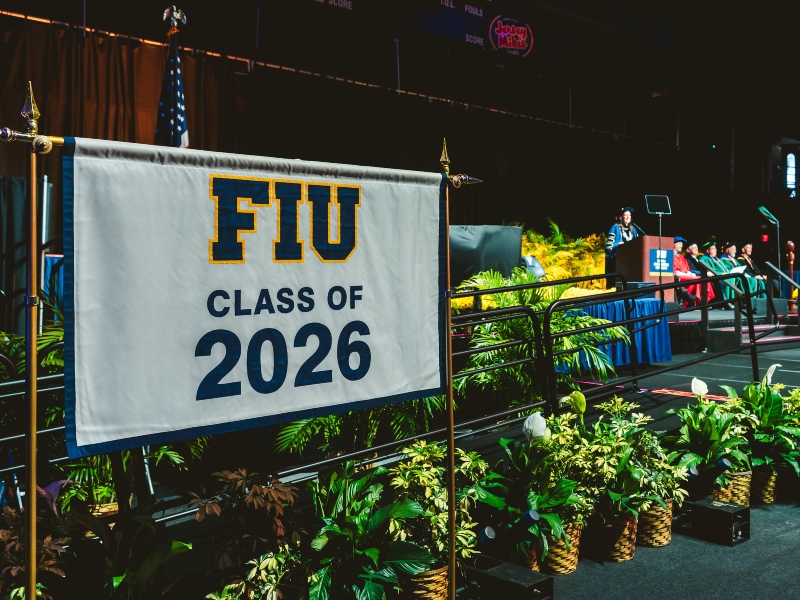 Class of 2026 banner and administrators on stage