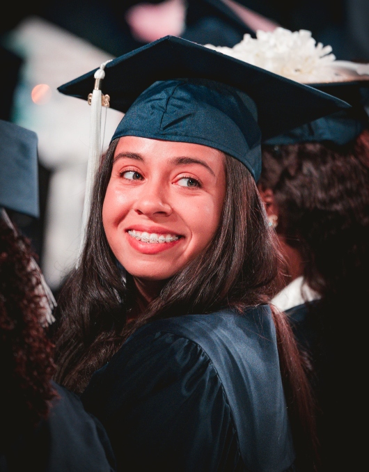 Graduate smiling during commencement