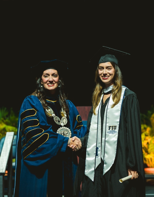 Student celebrating with diploma