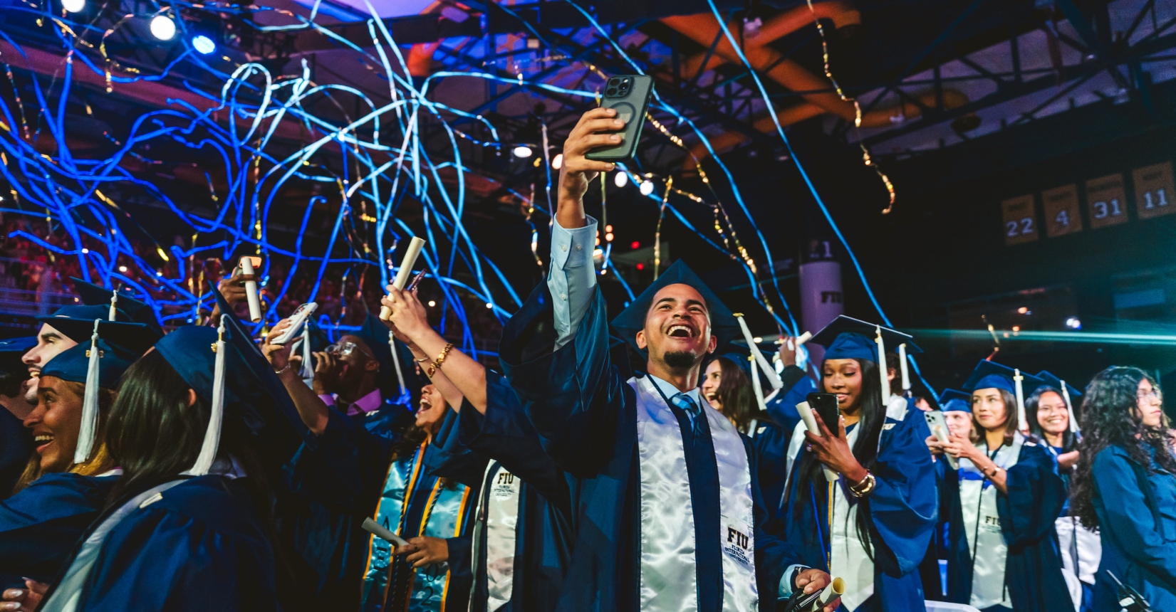 Students celebrating as confetti drops 