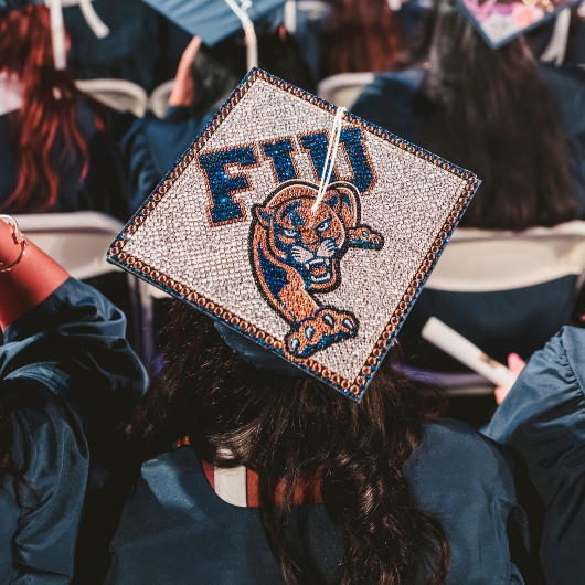 Graduate wearing cap with an FIU Panther theme