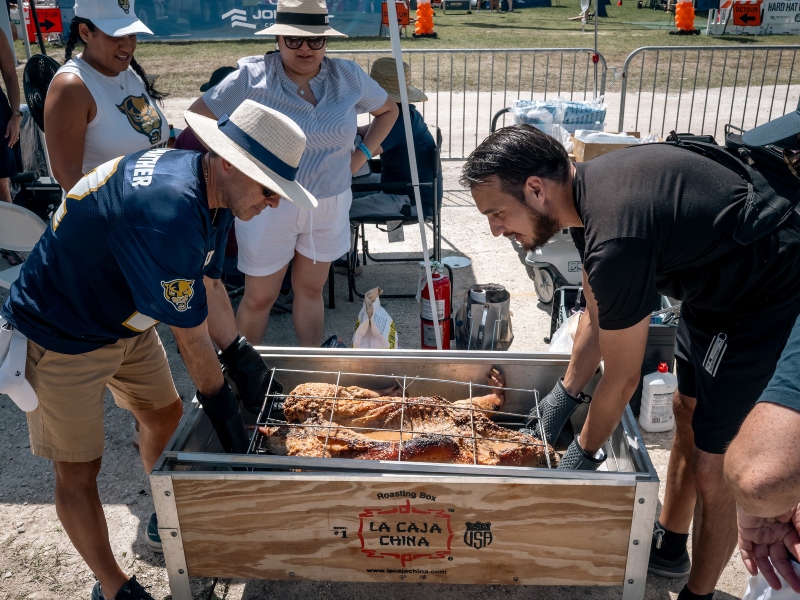 Attendees enjoying the pig roast