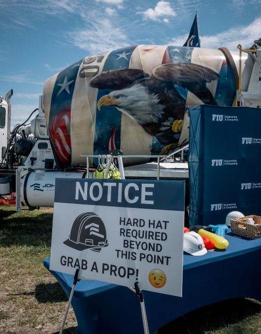 Construction Management display area featuring truck with American eagle drawing