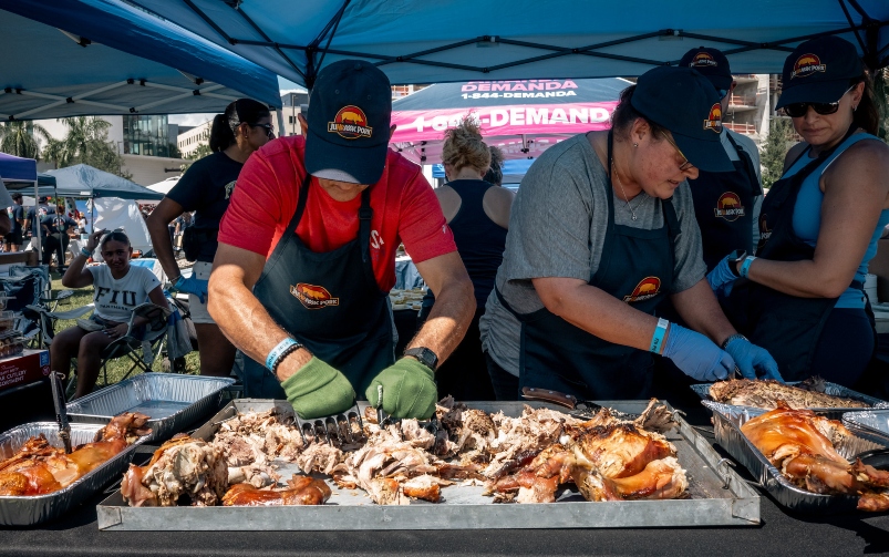 HR tent preparing their pork