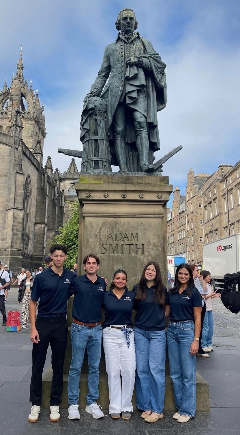 FIU students in front of the Adam Smith statue on the Royal Mile in Edinburgh